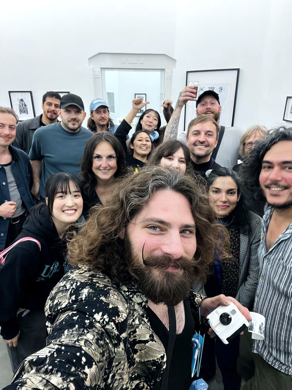 A crowd selfie in the packed gallery