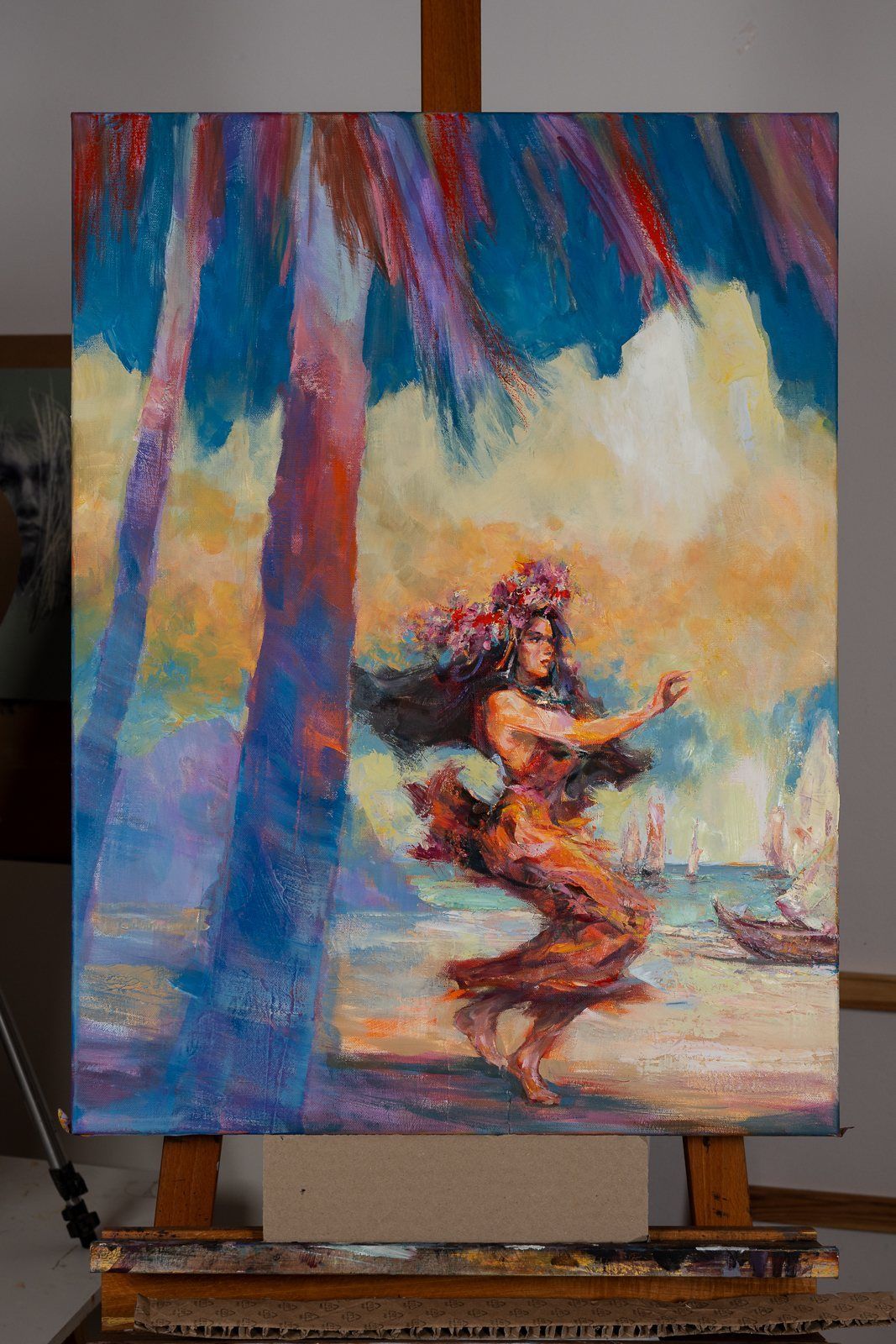 A dancer under palms, photographed straight on the easel
