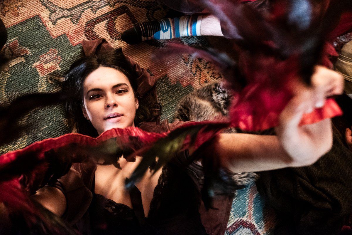 A dancer with red feathers
