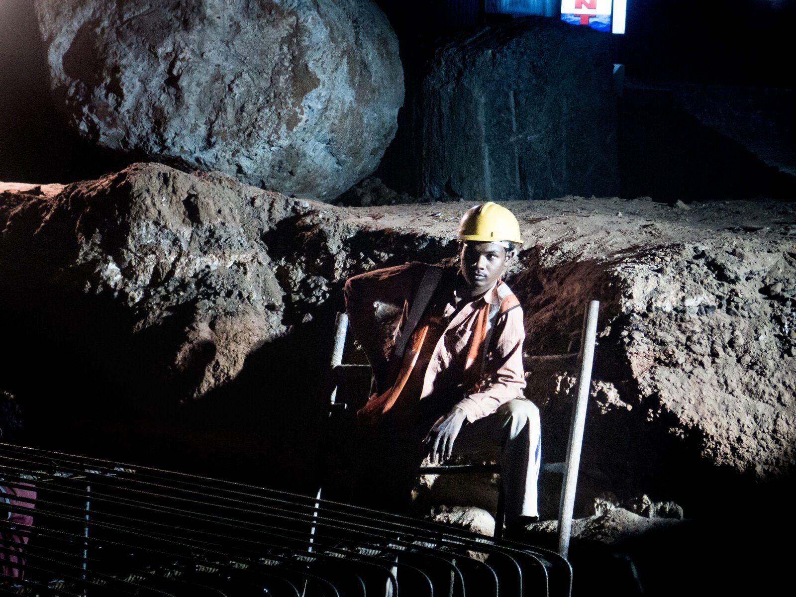 A man at work in a rock quarry