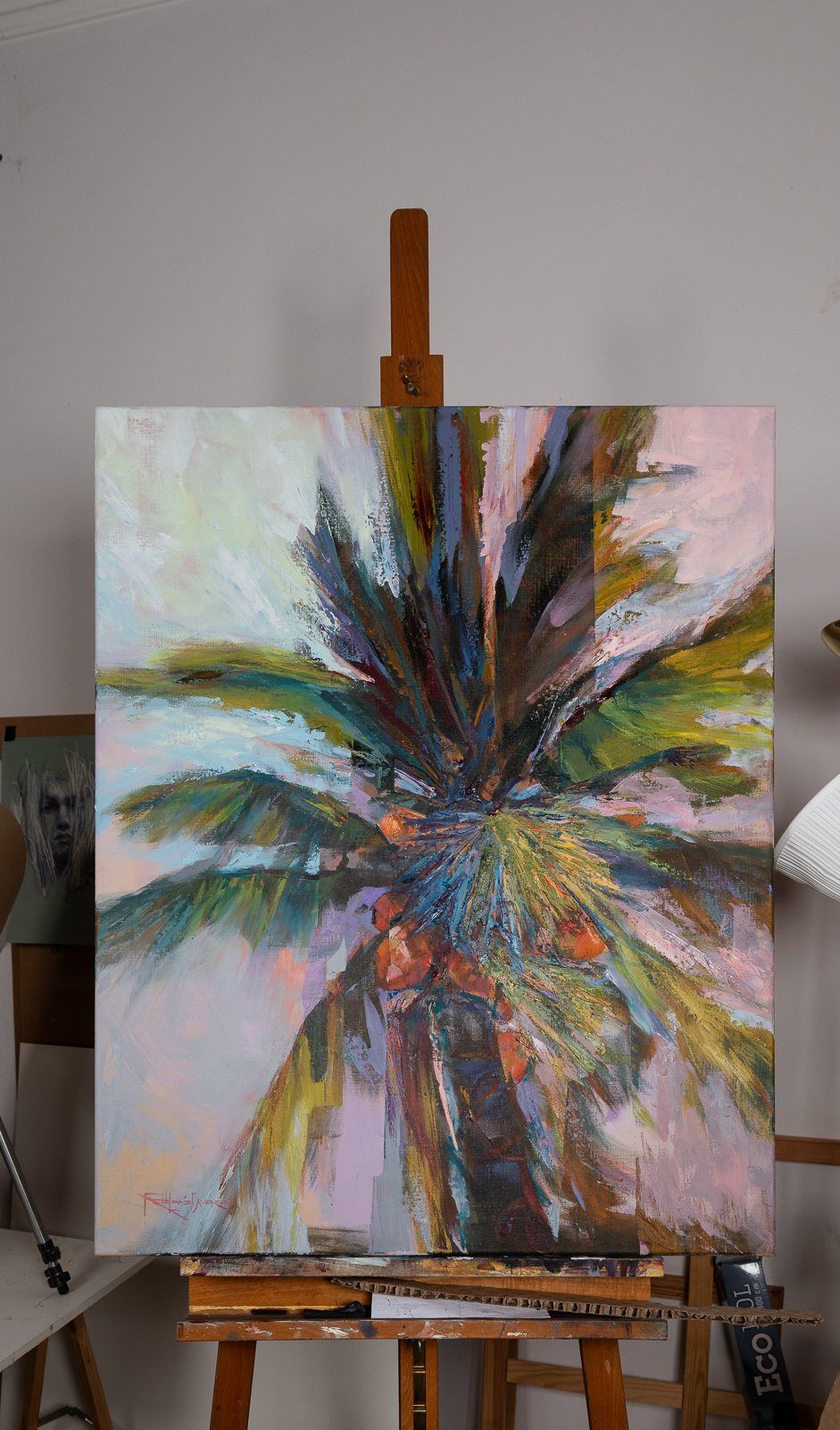 A palm painting on the easel, photographed straight