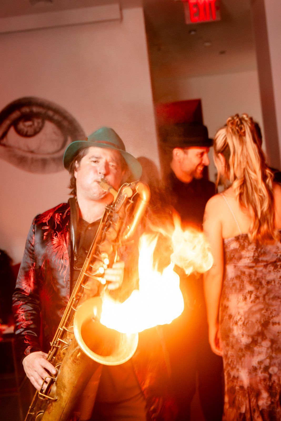 A saxophonist playing fire