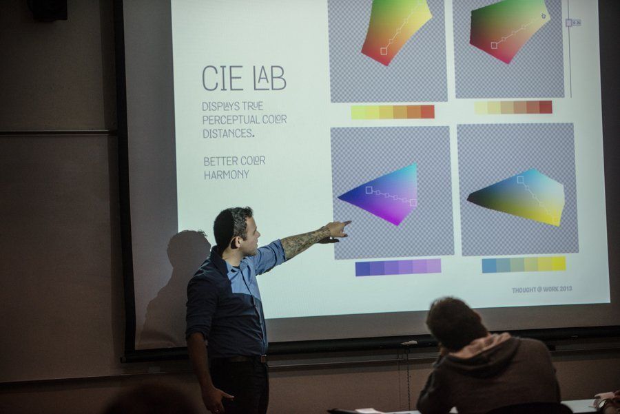 A speaker presenting colour theory slides