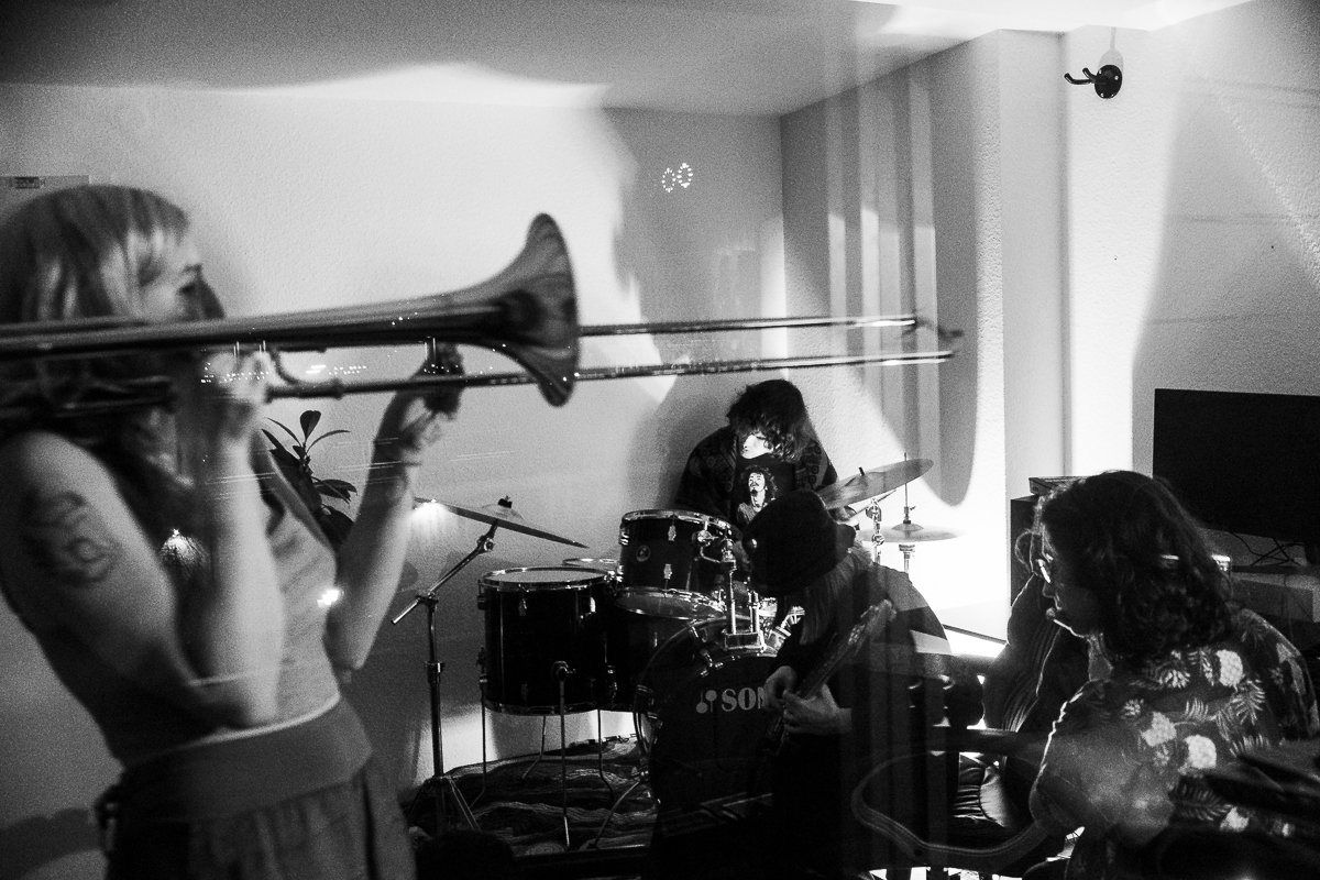 A trombonist in a living room
