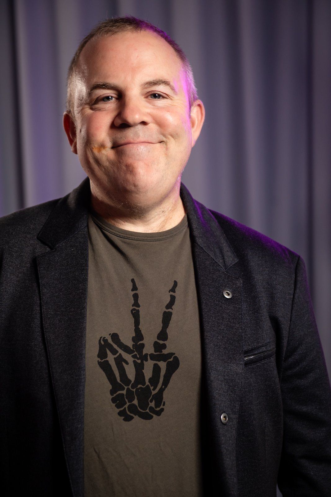 Event portrait: a guest smiling