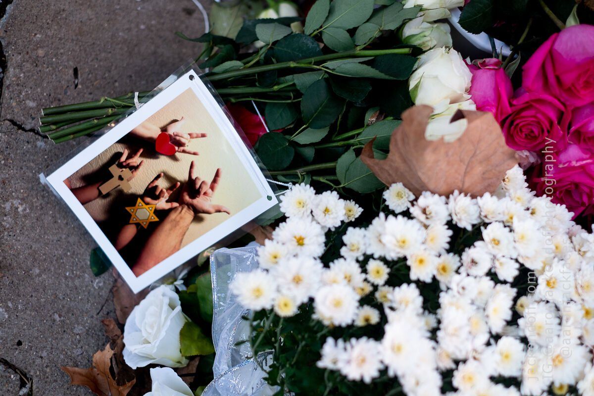 Flowers and a photograph left at the memorial