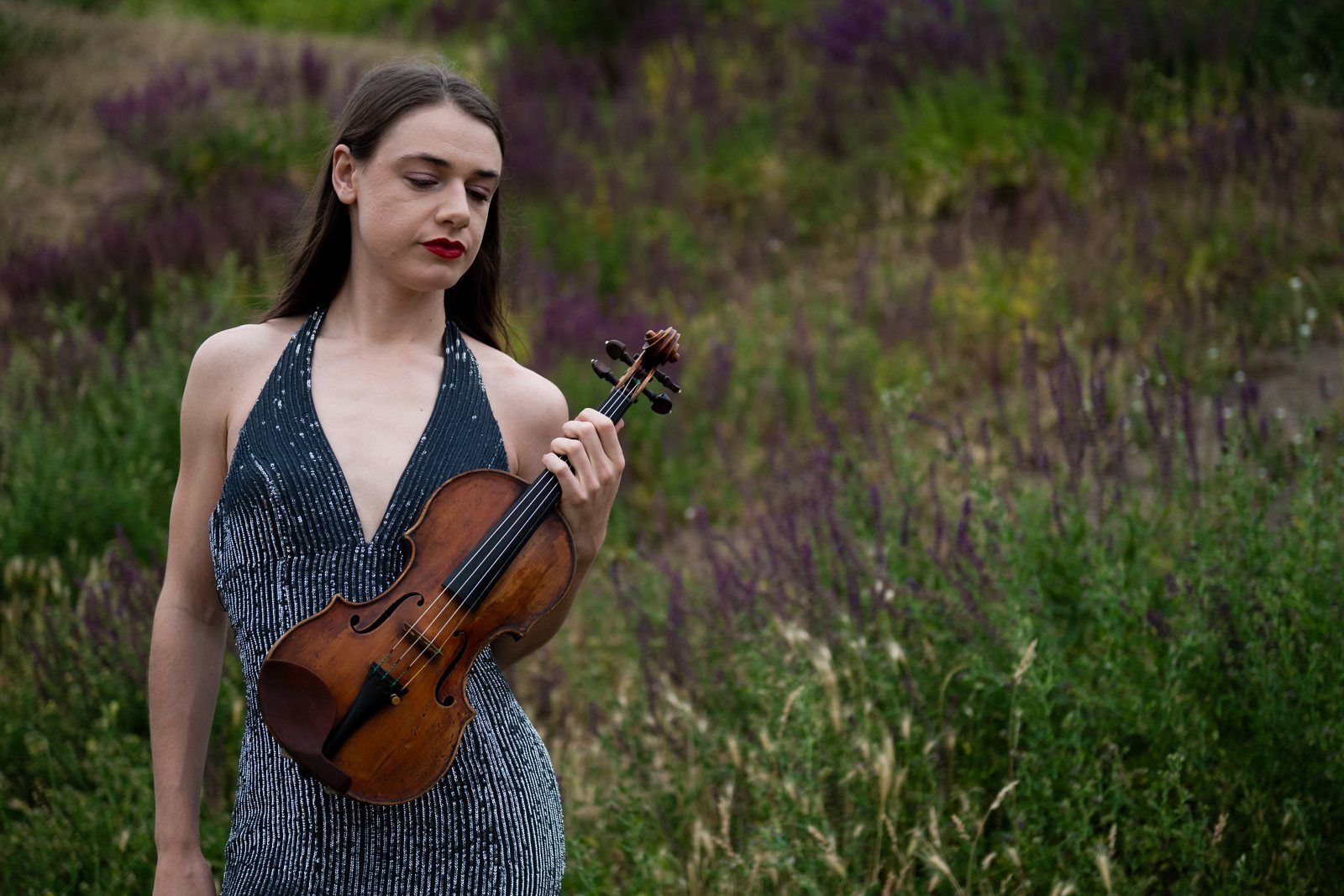Julia with her violin against the wildflowers
