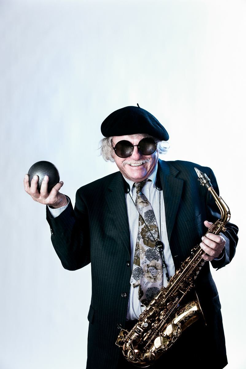 Richie Cole in a beret and sunglasses, holding his saxophone