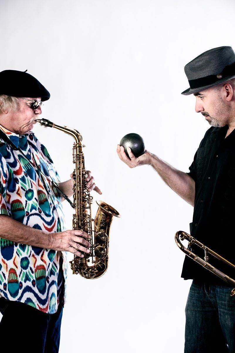 Richie Cole and a trombonist facing each other in the studio, Cannonball promo shoot