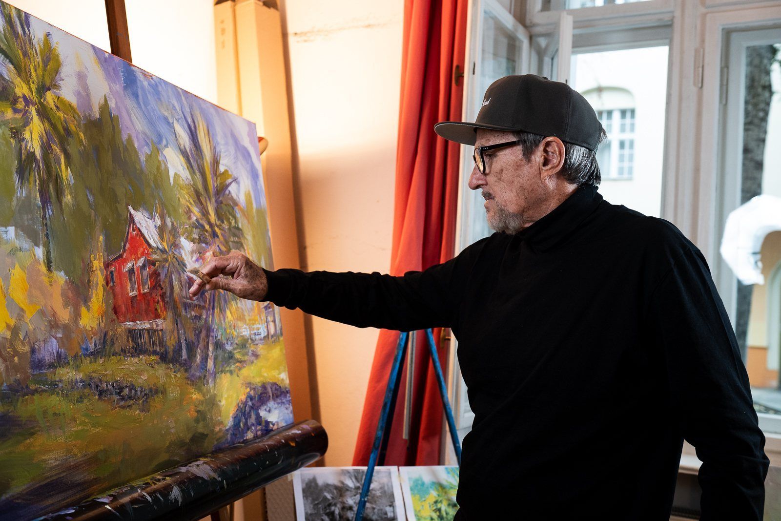 Rod Cameron painting a landscape at his easel