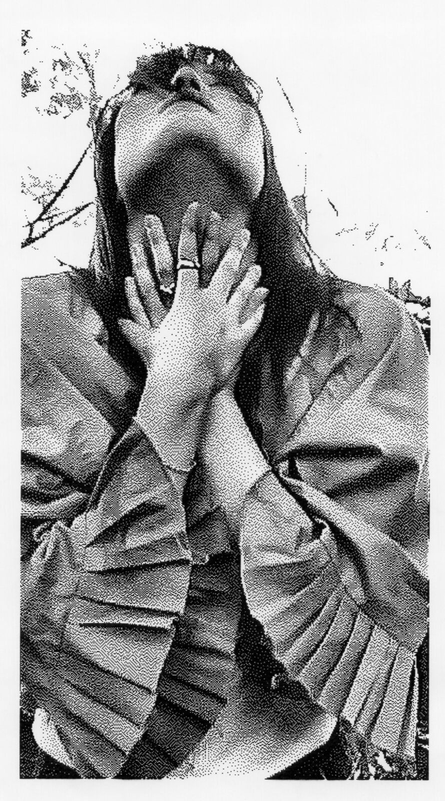 Thermal print: a woman with her hands over her face, in the trees
