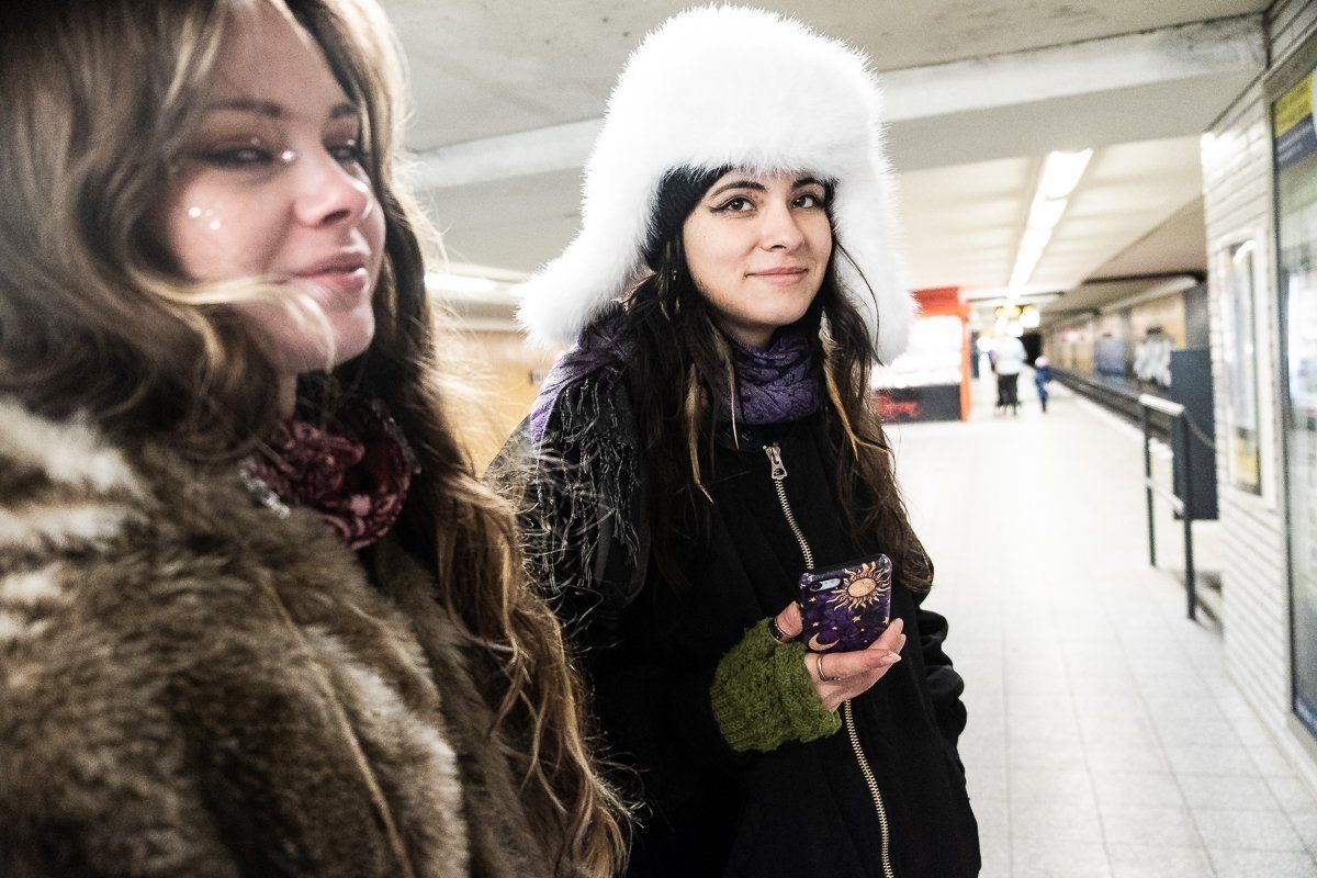Two friends on a station platform