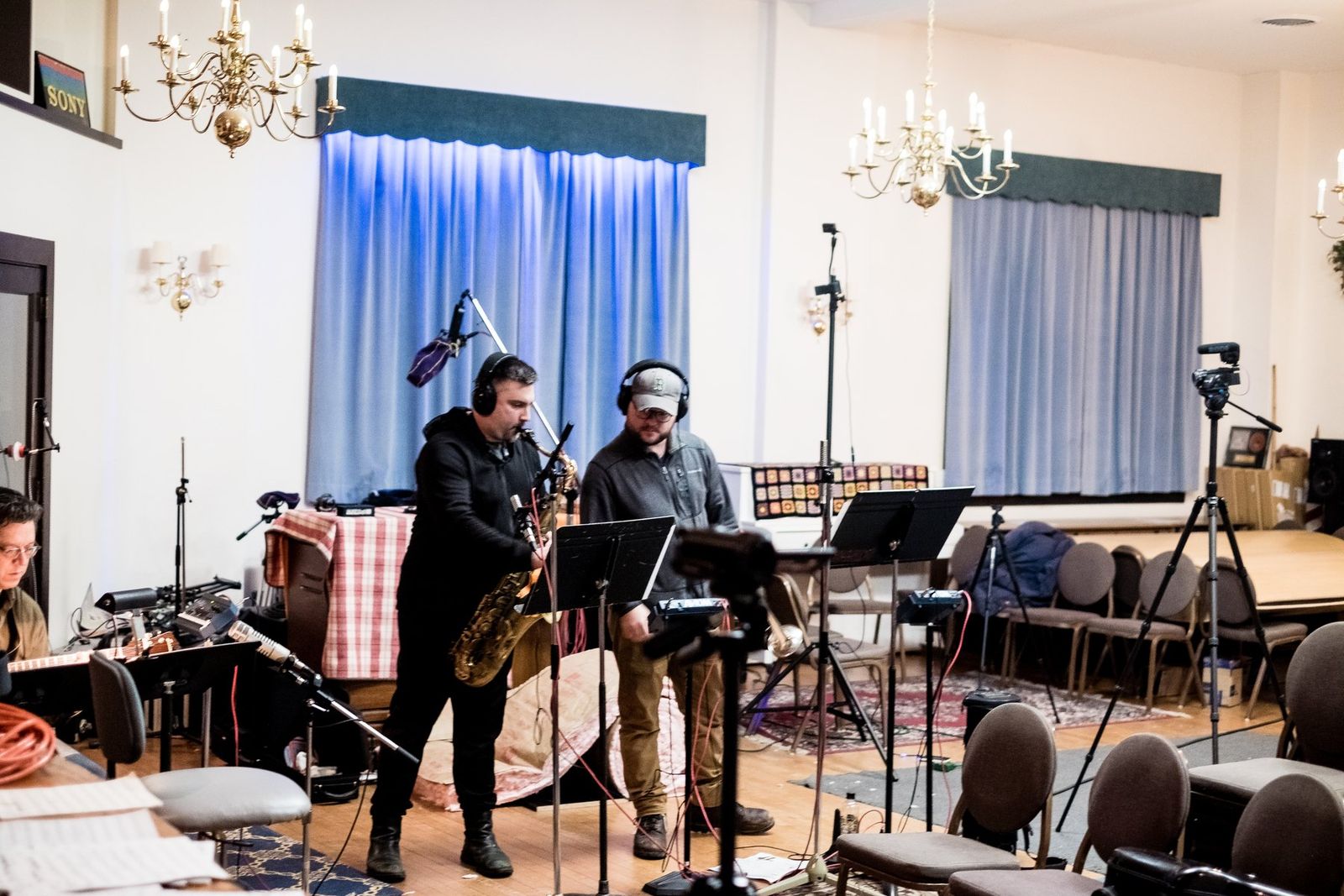 The band recording live in a studio room